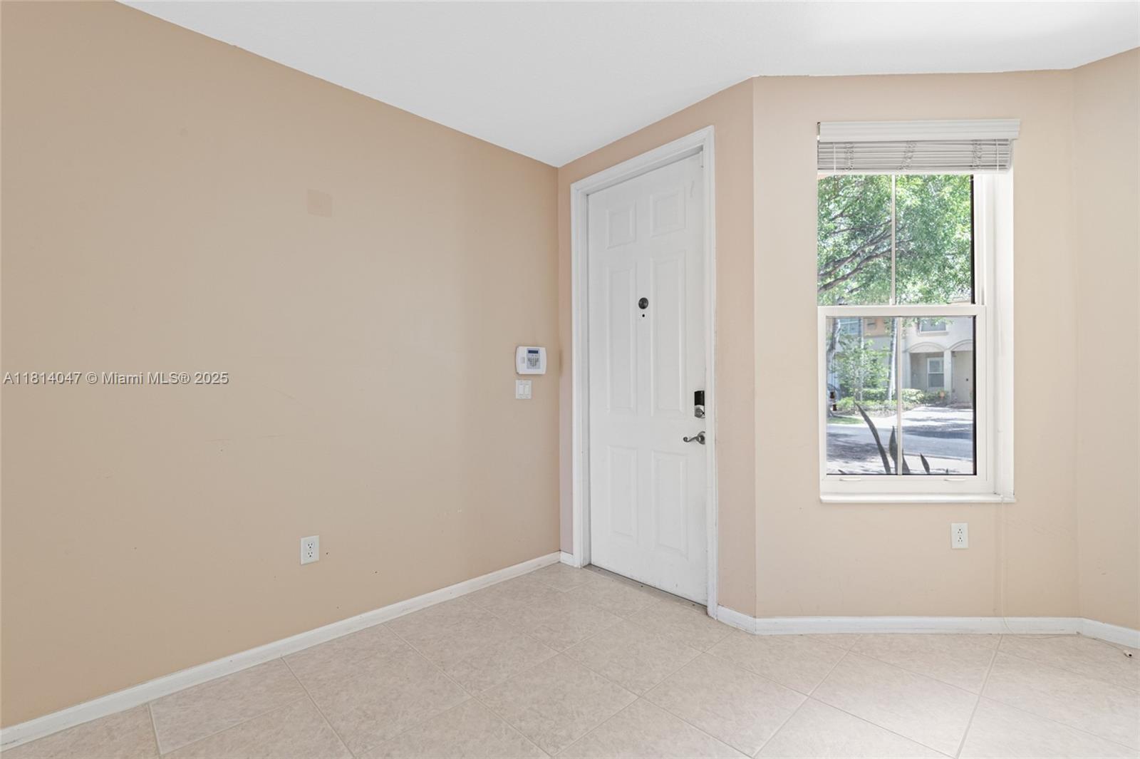 16316 Southwest 48th Street Miramar, FL 33027 - Photo 6 of 37 an empty room with windows