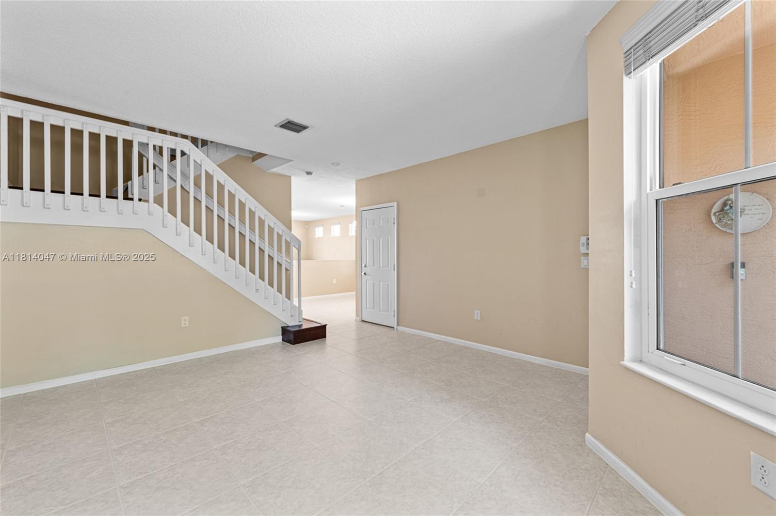 16316 Southwest 48th Street Miramar, FL 33027 - Photo 8 of 37 a view of an entryway with staircase