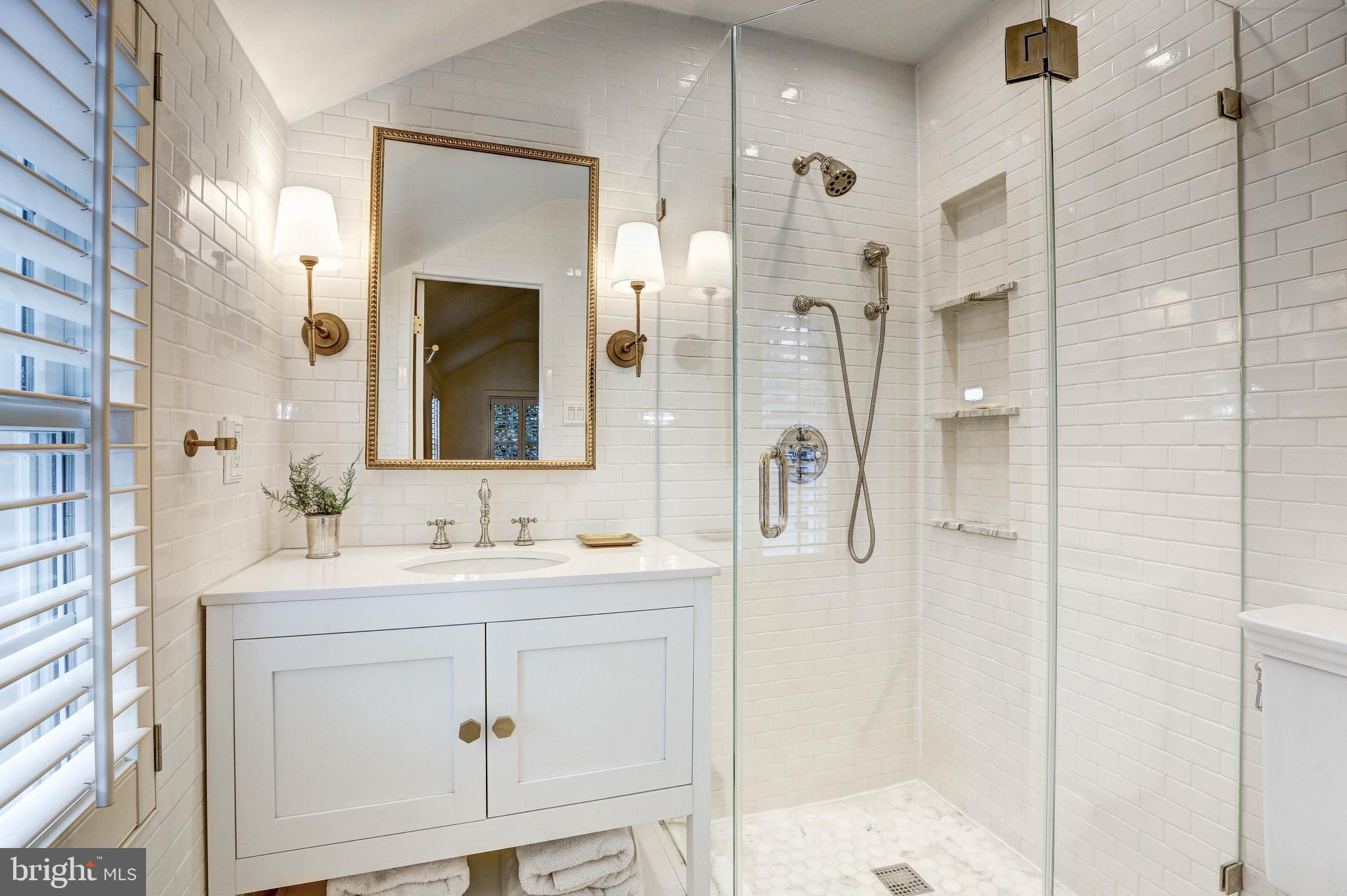 6001 Gloster Road Bethesda, MD 20816 - Photo 38 of 64 Master bathroom with marble tiles