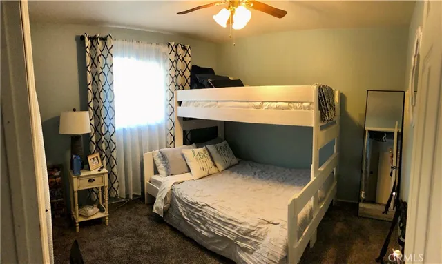 a bed room with a bed and a utility room