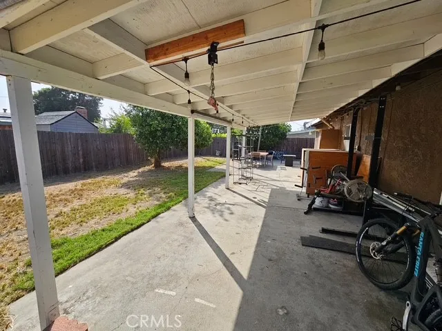a view of a patio with a table and chairs