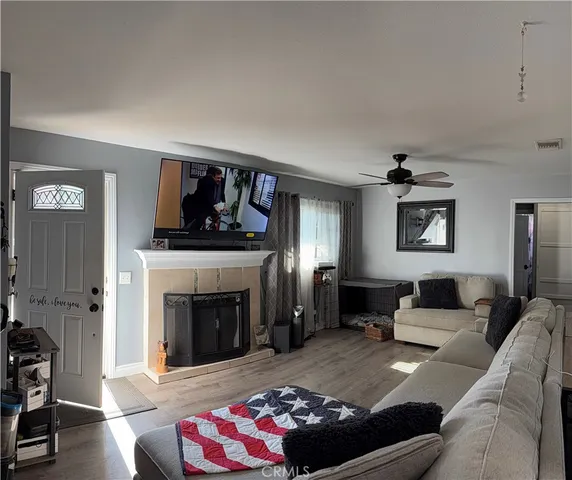 a living room with furniture and a fireplace