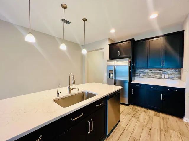 a spacious bathroom with a sink a large mirror and a bathtub