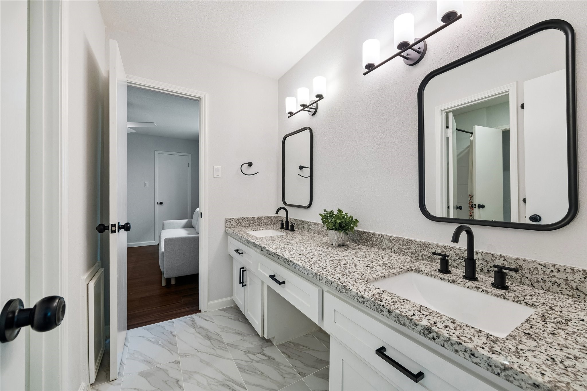 9707 Lawngate Drive Houston, TX 77080 - Photo 14 of 16 a bathroom with a granite countertop sink and a mirror