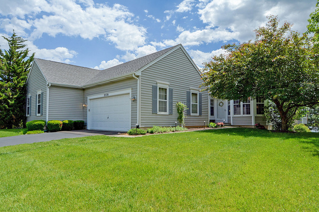 2570 Miller Road Geneva, IL 60134 - Photo 1 of 21 a backyard of a house with table and chairs