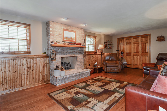 2570 Miller Road Geneva, IL 60134 - Photo 17 of 21 a living room with furniture and a fireplace