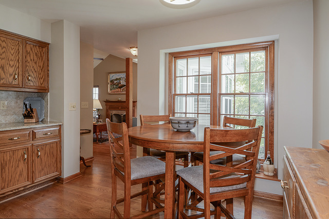 2570 Miller Road Geneva, IL 60134 - Photo 7 of 21 a view of a dining room with furniture and window
