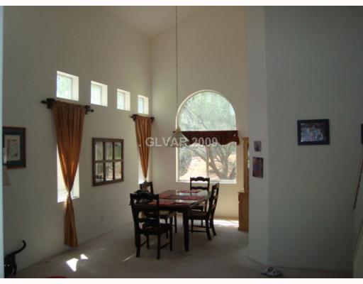265 Camelback Ridge Avenue Henderson, NV 89012 - Photo 3 of 12 Dining Room. FORMAL DINING AREA!! ALL WINDOW FIXTURES AND DRAPERY STAY!!