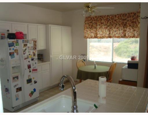 265 Camelback Ridge Avenue Henderson, NV 89012 - Photo 5 of 12 Kitchen. PANTRY AND PLENTY OF EXTRA CABINETRY SPACE!!