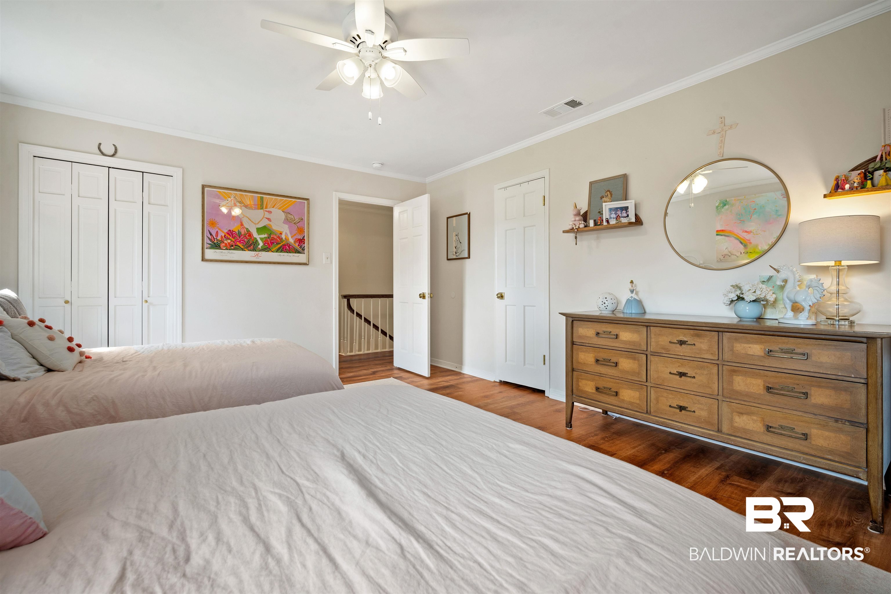 700 Eliza Jordan Road North Mobile, AL 36608 - Photo 28 of 44 Bedroom with dark wood-style floors, ornamental molding, ceiling fan, and a closet