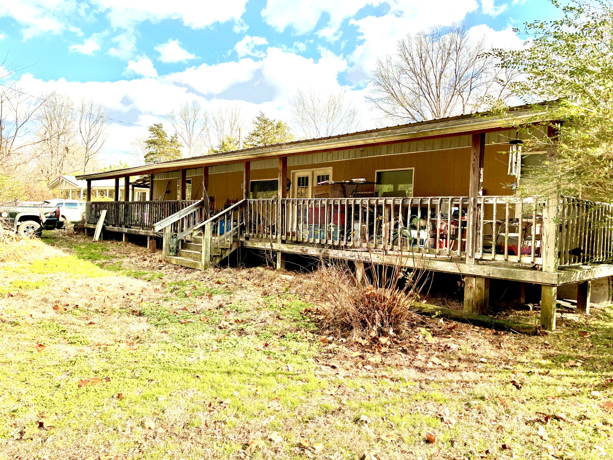 a view of a house with pool and sitting area