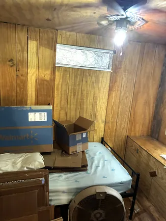 a bed sitting in a room next to a window