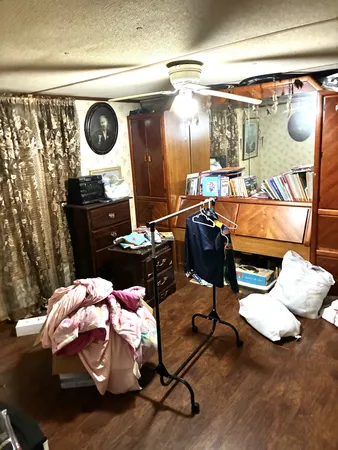 a bedroom with a bed and cabinets