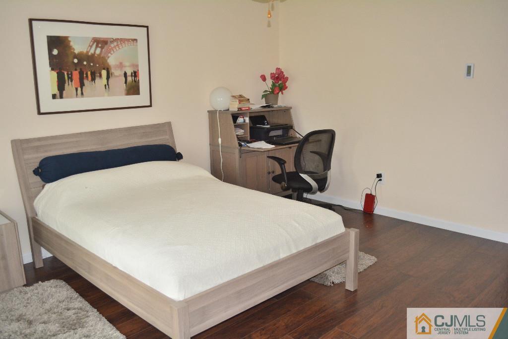 39 B Haddon Road Monroe Township, NJ 08831 - Photo 13 of 22 a bedroom with a bed and a desk