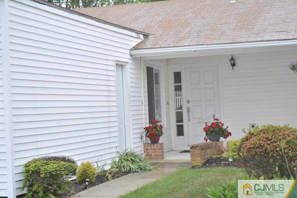 39 B Haddon Road Monroe Township, NJ 08831 - Photo 20 of 22 a front view of a house with a yard