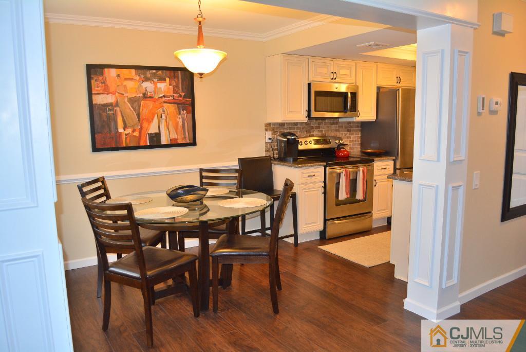 39 B Haddon Road Monroe Township, NJ 08831 - Photo 3 of 22 a view of a dining room with furniture window and wooden floor