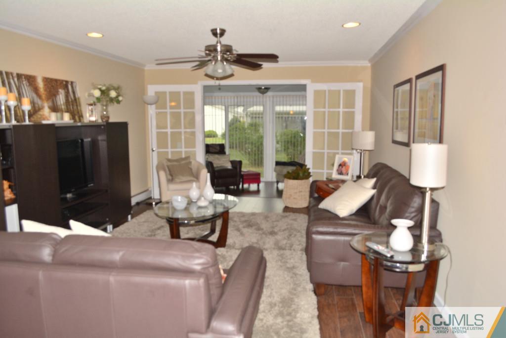 39 B Haddon Road Monroe Township, NJ 08831 - Photo 7 of 22 a living room with furniture and large windows