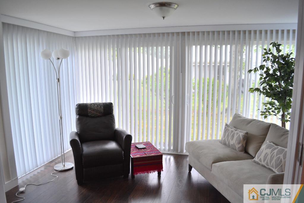 39 B Haddon Road Monroe Township, NJ 08831 - Photo 10 of 22 a living room with furniture and a potted plant