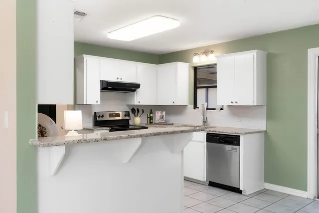 a view of balcony with wooden floor