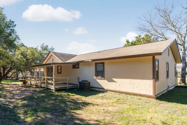 a view of a small house in the back yard