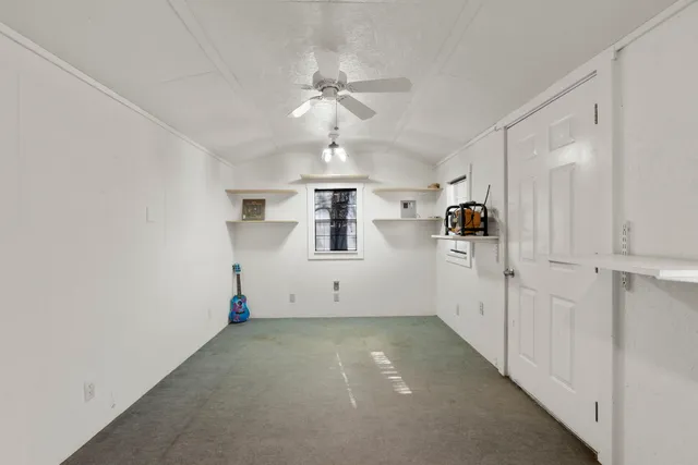 a house is covered with snow and trees