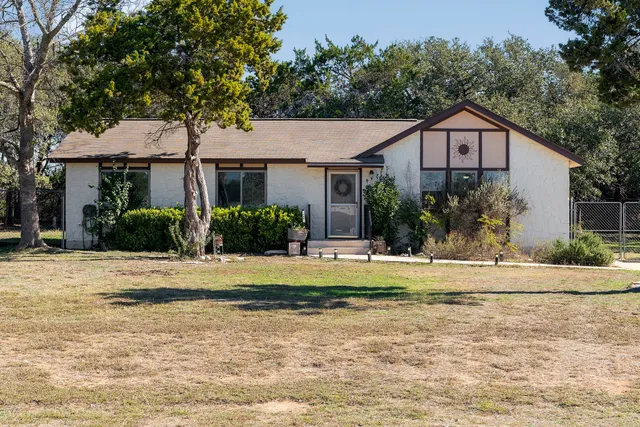 a hallway with a sink and a mirror