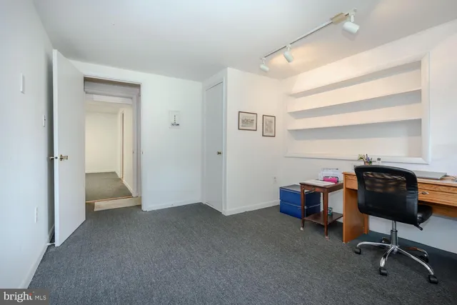 a view of a workspace with furniture