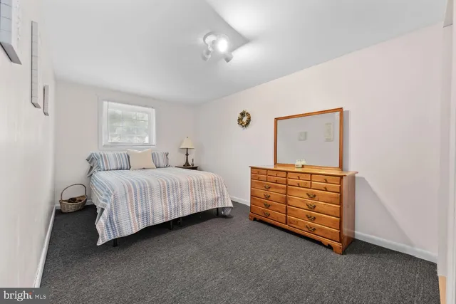 a bedroom with a bed and a cabinets