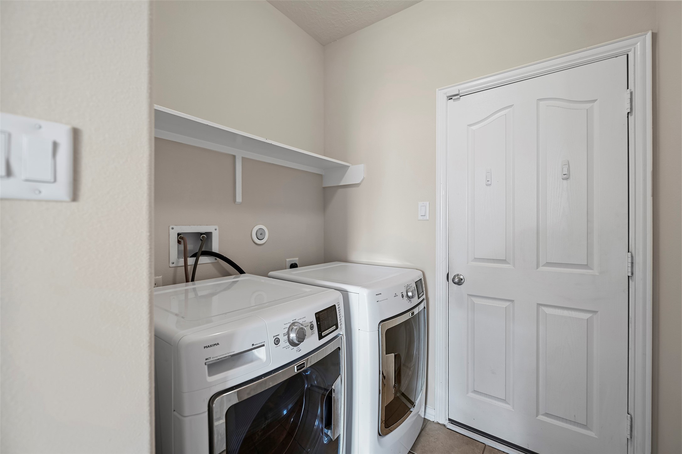 8323 Rudy Brook Way Spring, TX 77379 - Photo 20 of 35 a utility room with dryer and washer