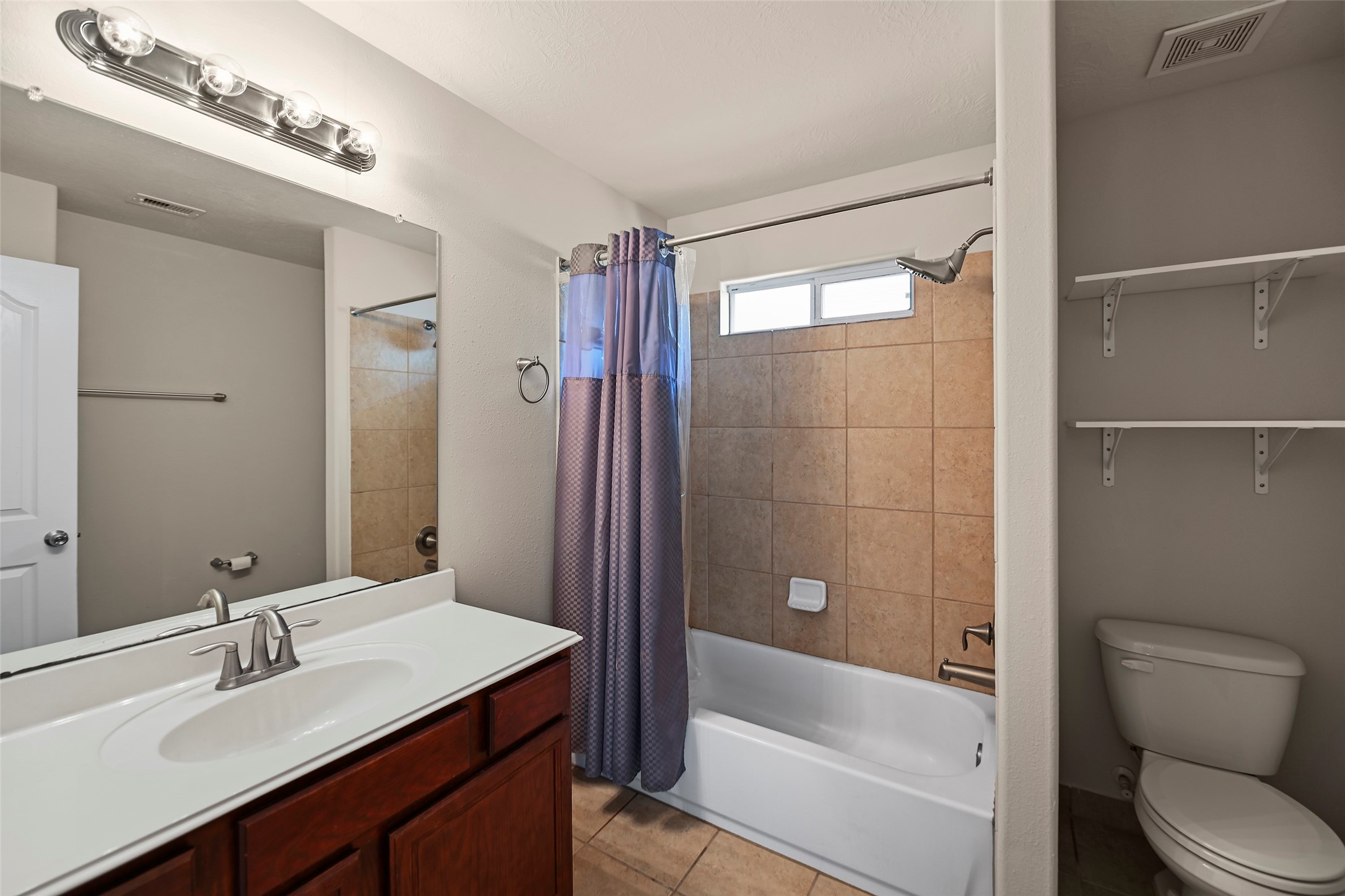 8323 Rudy Brook Way Spring, TX 77379 - Photo 27 of 35 a bathroom with a sink a toilet and shower