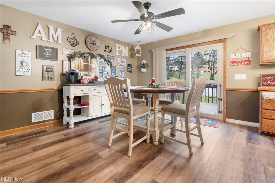 4915 Monticello Street Northwest Canton, OH 44708 - Photo 15 of 31 Dining area with dark hardwood / wood-style flooring and ceiling fan