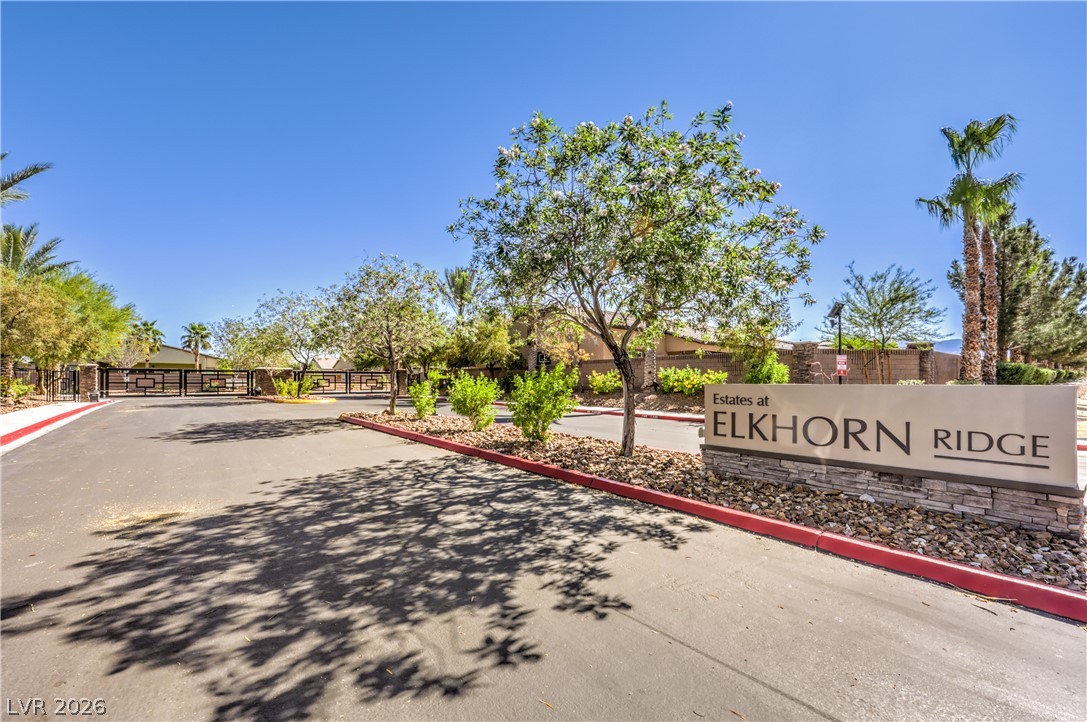 7119 Arabian Ridge Street Las Vegas, NV 89131 - Photo 67 of 73 Secure community entrance with tasteful landscaping, welcoming residents and visitors alike.