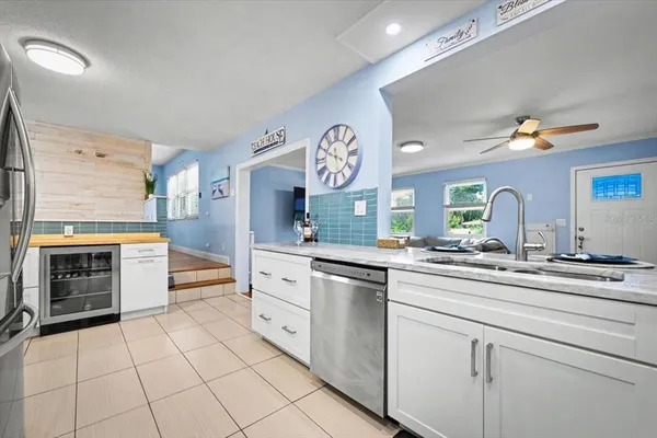 a kitchen with a sink cabinets and stainless steel appliances
