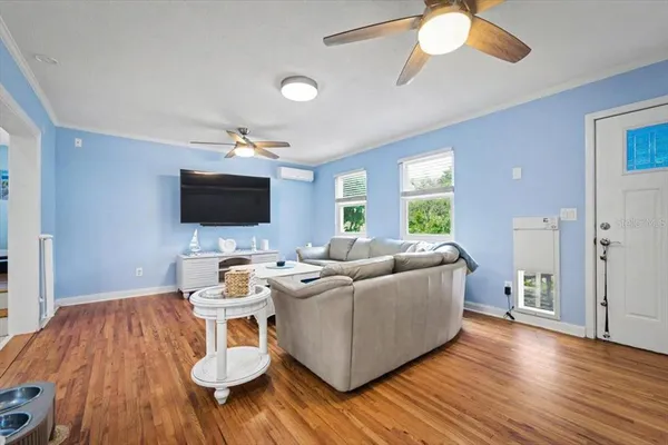 a living room with furniture and a flat screen tv