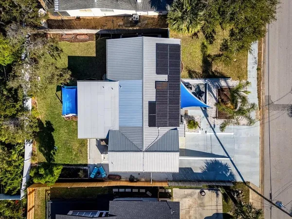 a aerial view of a house with a yard