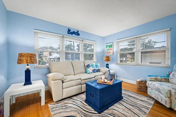a living room with furniture and a window