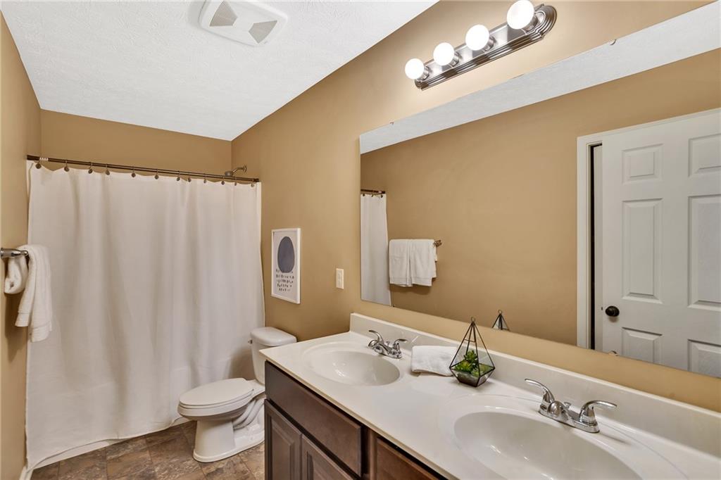 201 Millstream Lane Zelienople, PA 16063 - Photo 28 of 48 a bathroom with a granite countertop sink and a mirror
