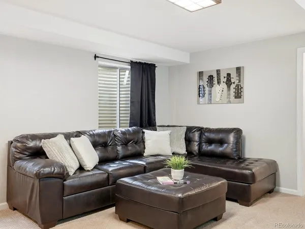 a living room with furniture and a table