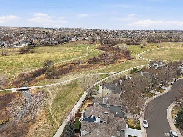 an aerial view of residential houses with outdoor space