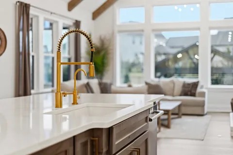 a view of a dining room with furniture and window