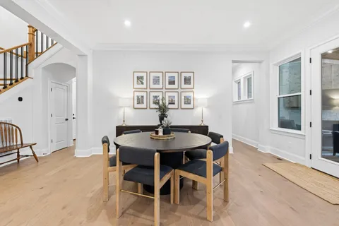 a bedroom with furniture and a large window
