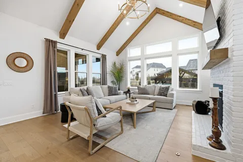 a bed room with a bed and a chair