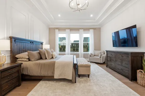a white bath tub sitting in a en suite bathroom