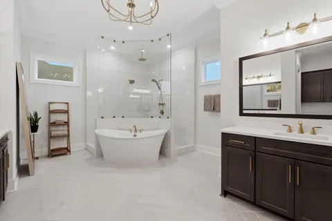 a view of walk in closet with clothes