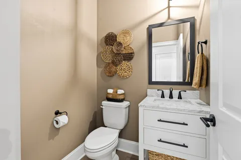 a bathroom with a sink and chandelier