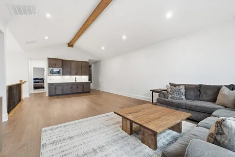 a bathroom with a sink a toilet a mirror and shower curtain