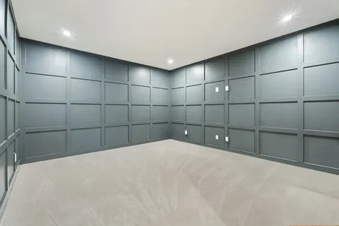 a bedroom with a bed a desk and chair