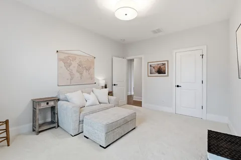 a view of a brick house with a yard