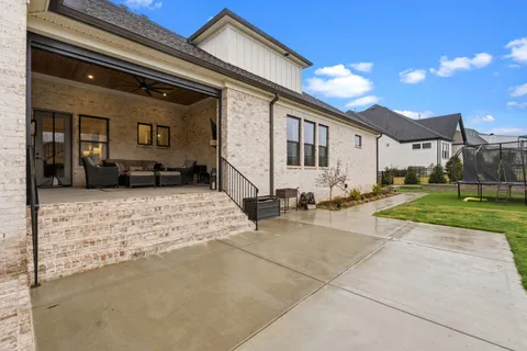 a view of a yard with a swimming pool