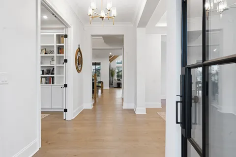 a view of a room with a ceiling fan and window